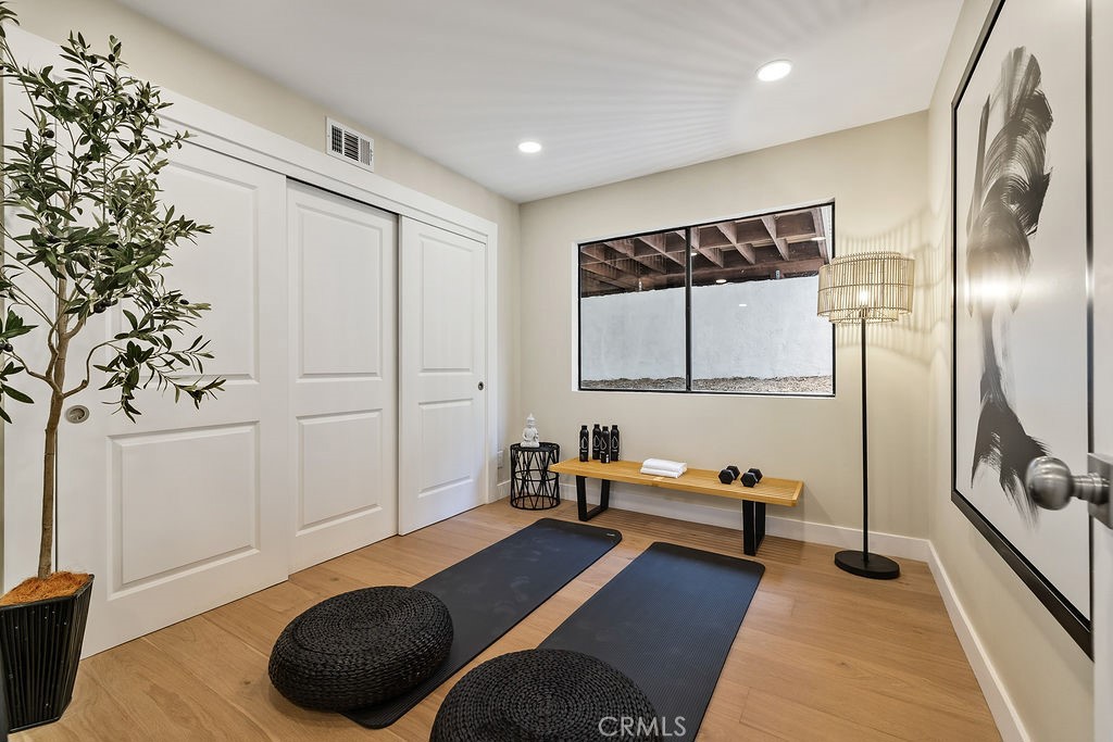 275 Fairview Road Ojai, CA 93023 - Photo 46 of 74 a bedroom with a bed and a chandelier