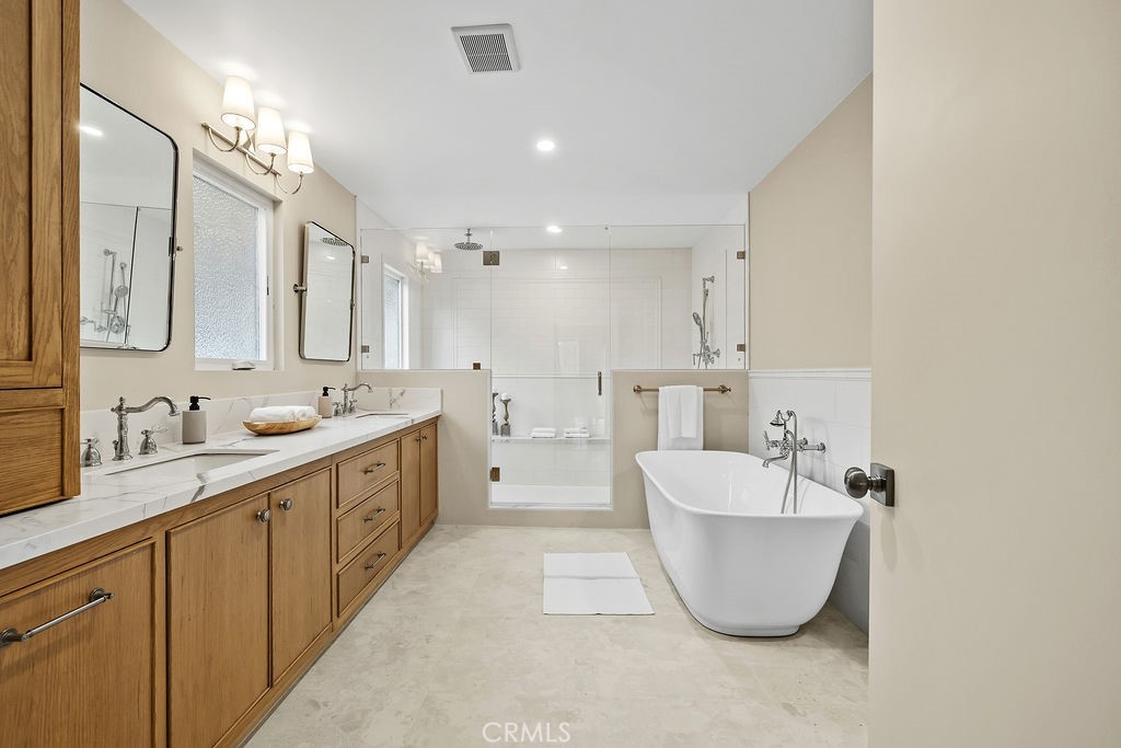275 Fairview Road Ojai, CA 93023 - Photo 52 of 74 a large bathroom with a double vanity sink mirror and bathtub