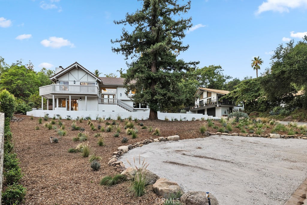 275 Fairview Road Ojai, CA 93023 - Photo 66 of 74 a front view of a house with a yard covered with snow and trees
