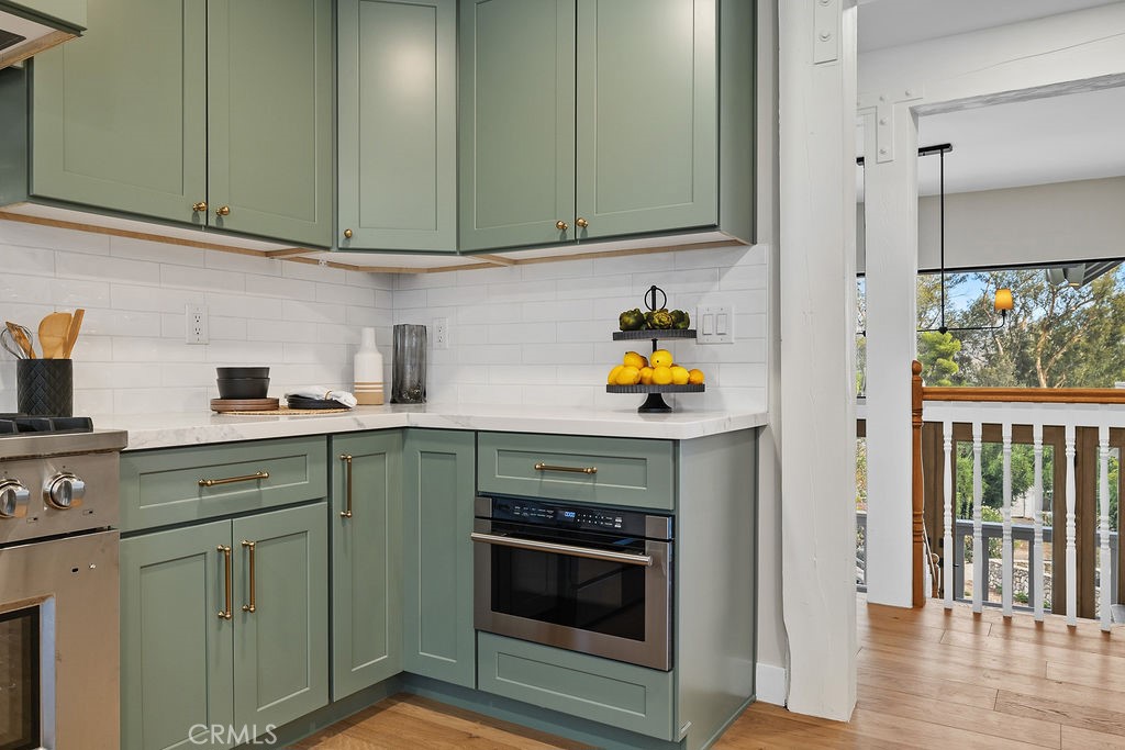 275 Fairview Road Ojai, CA 93023 - Photo 10 of 74 a kitchen with stainless steel appliances white cabinets and a stove top oven
