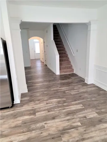 a view of entryway with wooden floor
