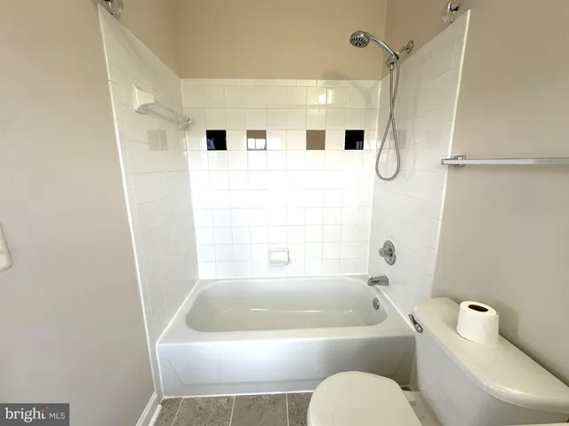 a bathroom with a sink toilet a shower and a bathtub