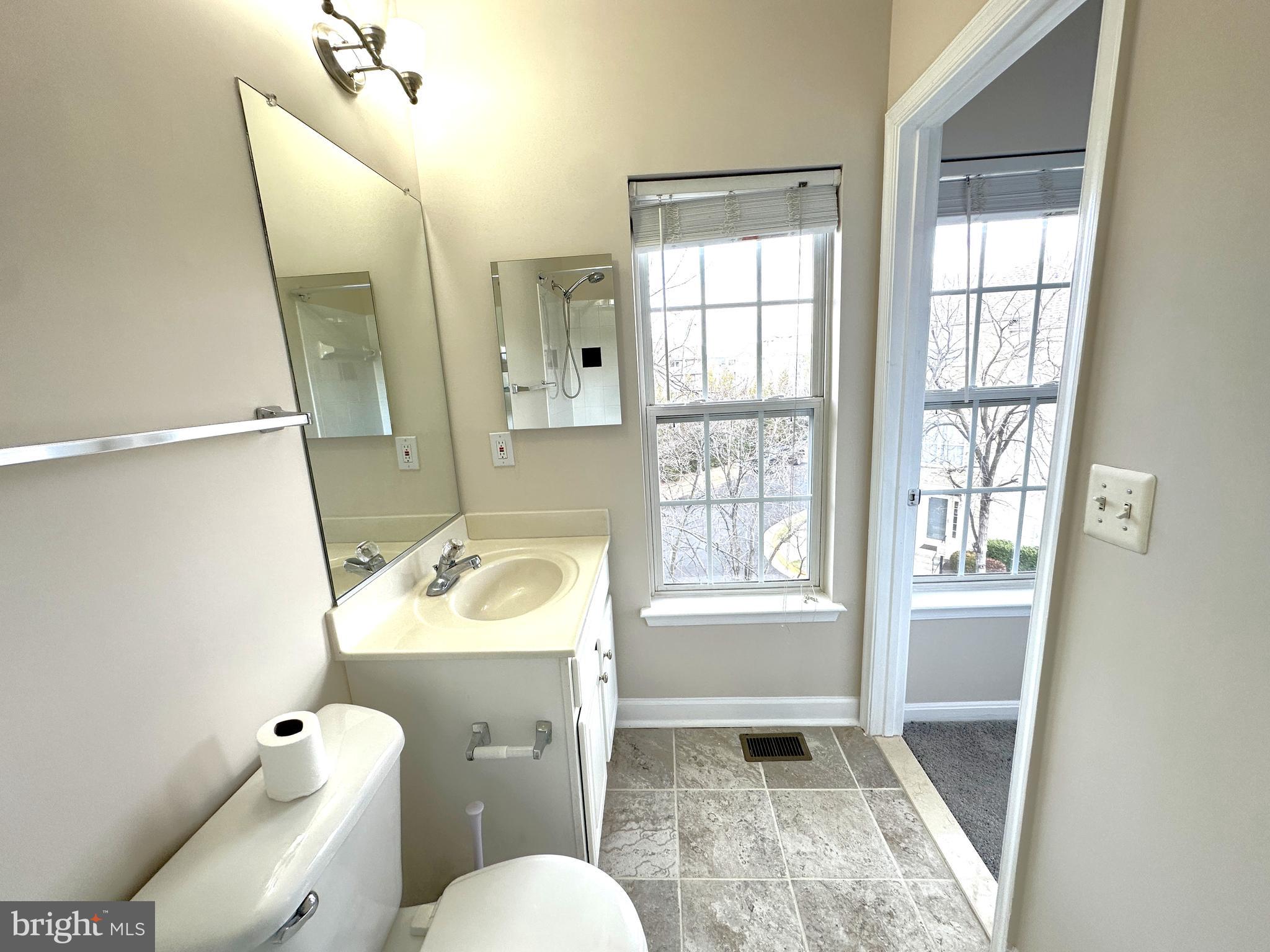 21798 Jarvis Square Ashburn, VA 20147 - Photo 19 of 29 a bathroom with a sink toilet and shower
