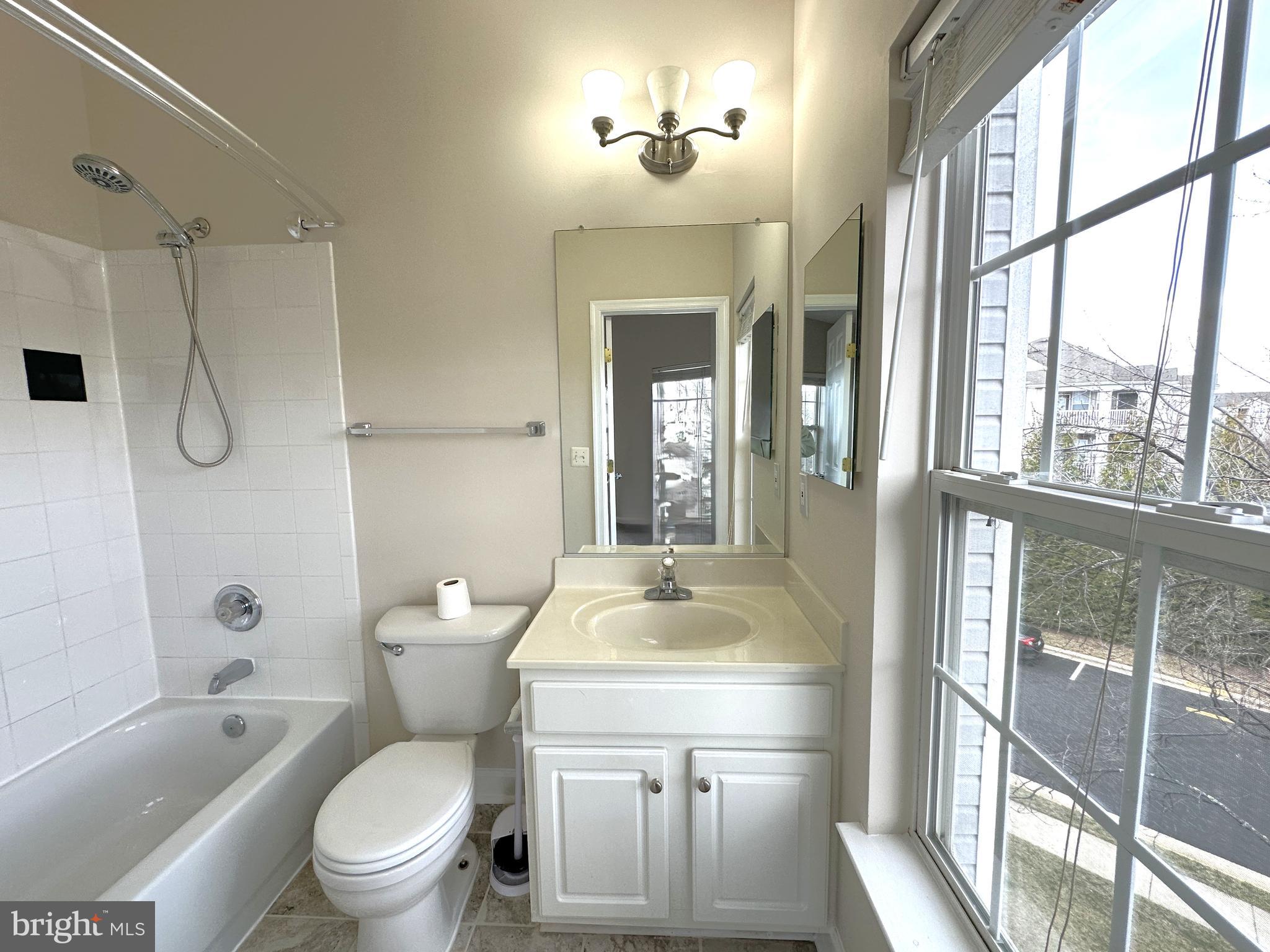 21798 Jarvis Square Ashburn, VA 20147 - Photo 20 of 29 a bathroom with a sink toilet a shower and a bathtub