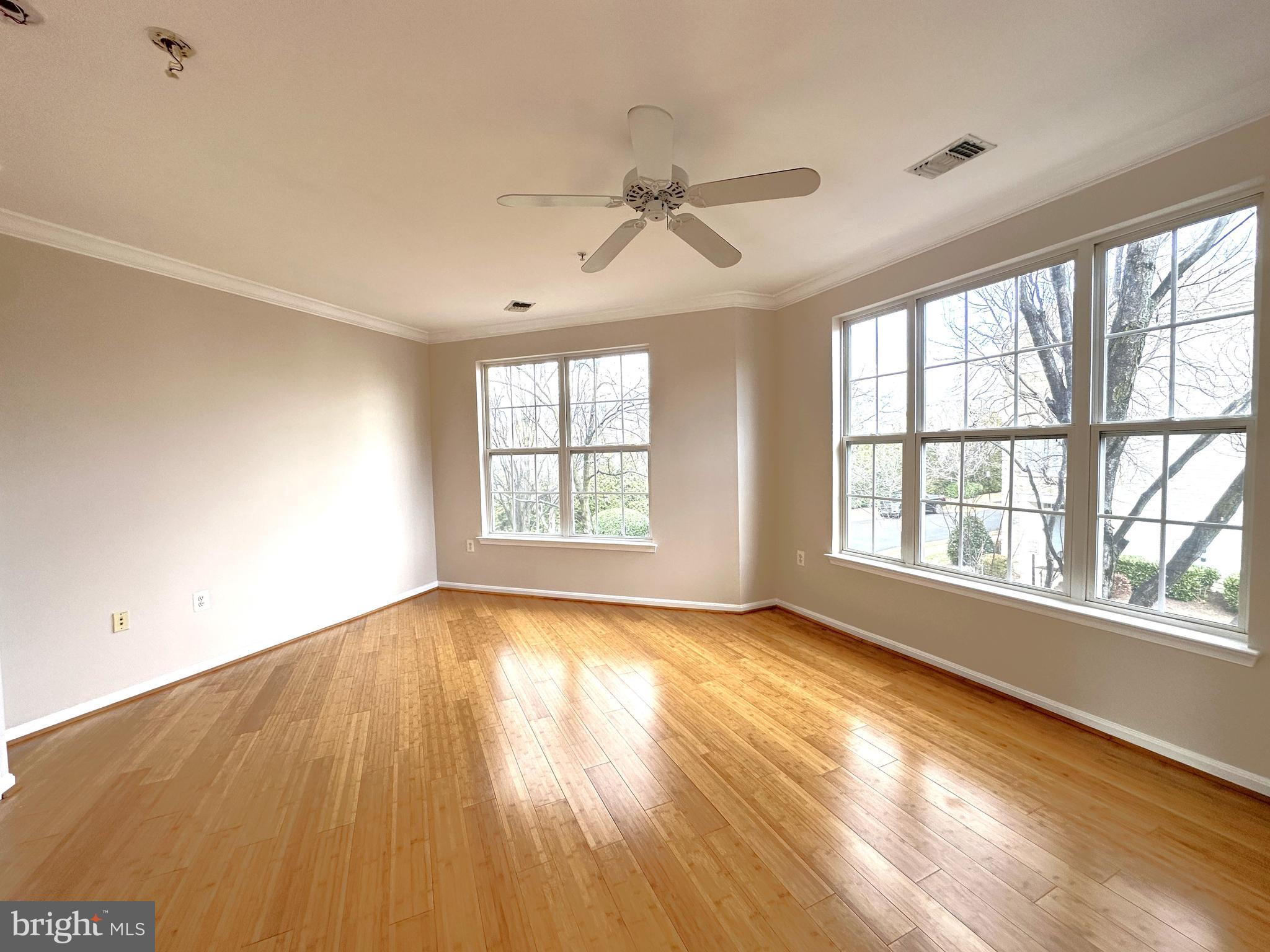 21798 Jarvis Square Ashburn, VA 20147 - Photo 4 of 29 wooden floor in an empty room with a window