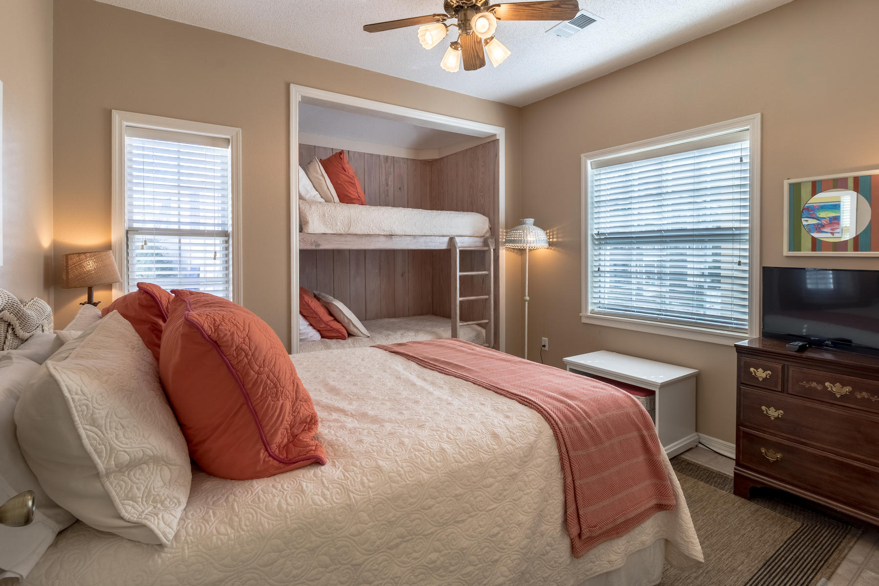 701 Eastern Lake Road Santa Rosa Beach, FL 32459 - Photo 17 of 45 a bedroom with a bed and a flat screen tv with dresser