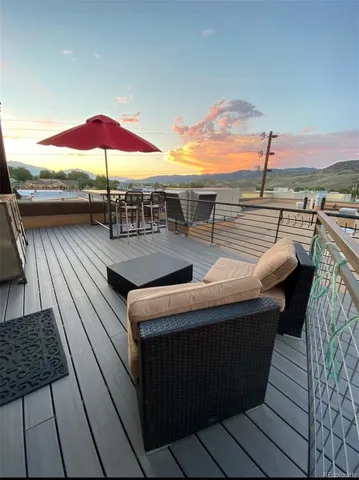 swimming pool view with a seating space