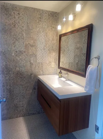 a bathroom with a sink and a mirror