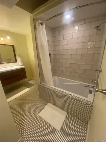 a bathroom with a shower and a bathtub