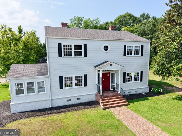 a aerial view of a house with a yard