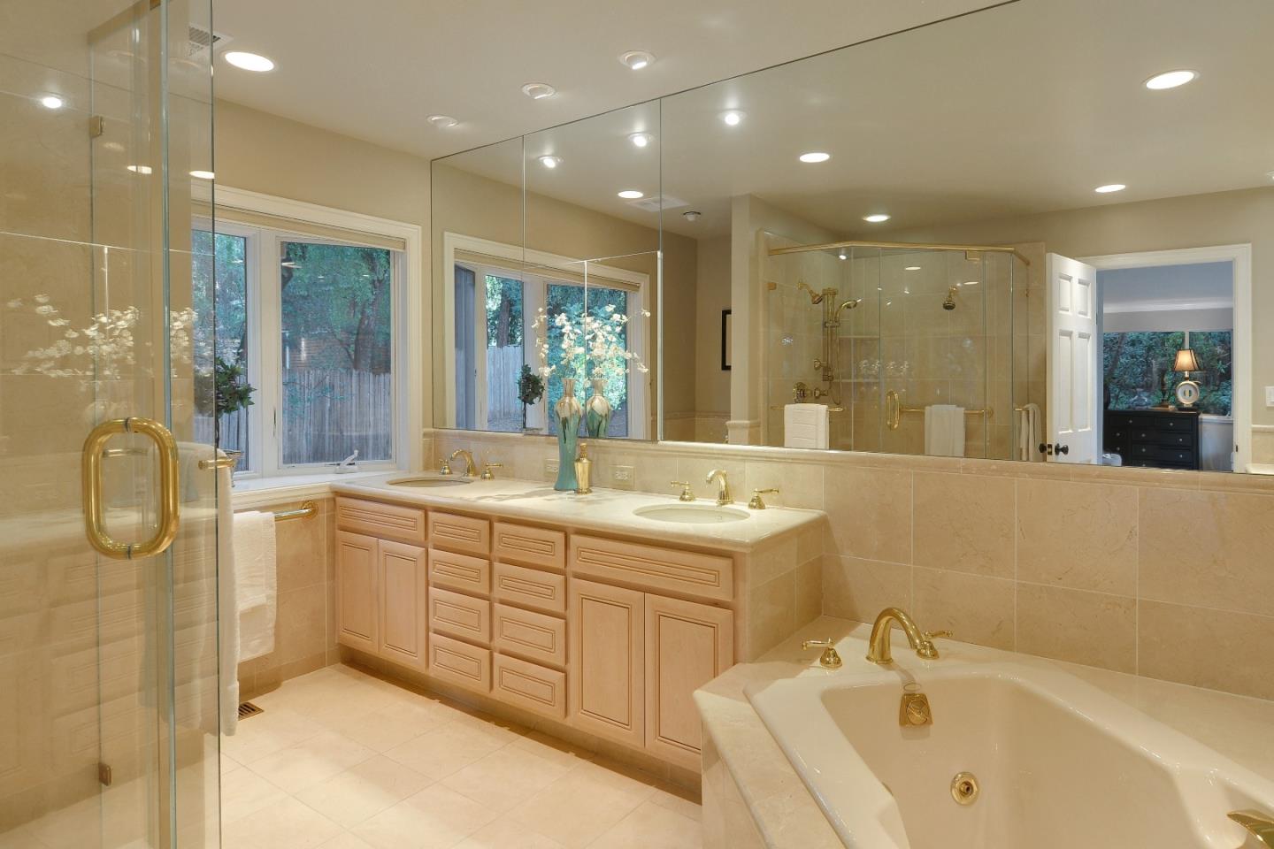 3470 Tripp Road Woodside, CA 94062 - Photo 11 of 34 a bathroom with a tub sink and mirror
