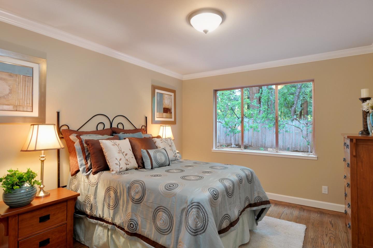 3470 Tripp Road Woodside, CA 94062 - Photo 17 of 34 a bedroom with a bed and a window