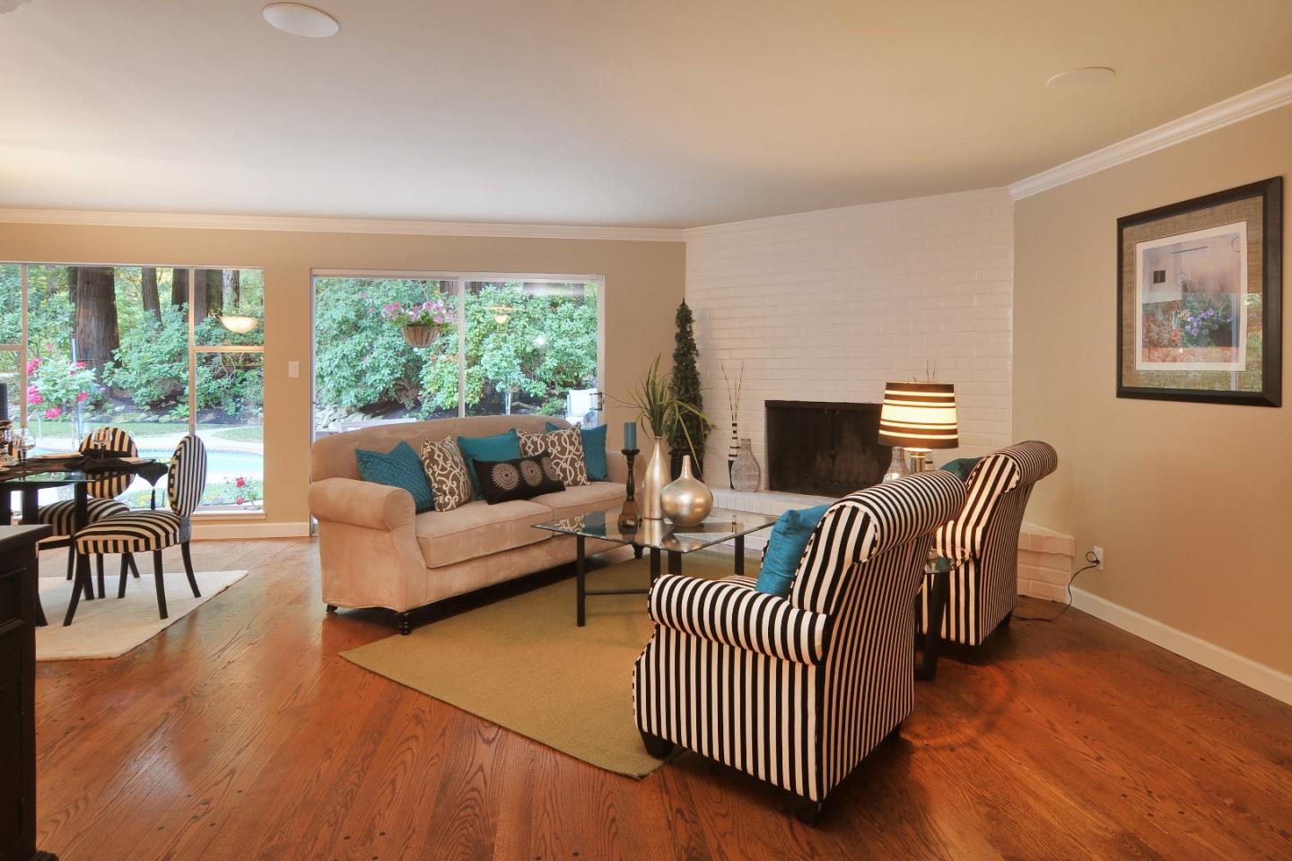 3470 Tripp Road Woodside, CA 94062 - Photo 4 of 34 a living room with furniture and a fireplace