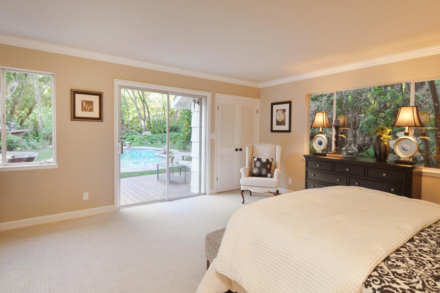 3470 Tripp Road Woodside, CA 94062 - Photo 10 of 34 a bedroom with a large bed and a large window