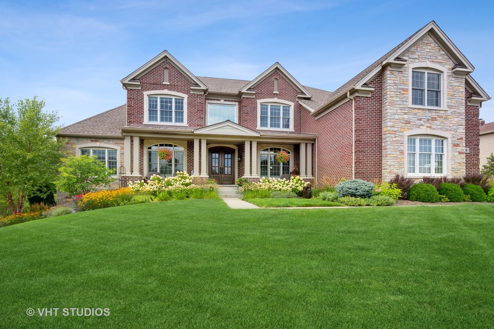 12 Shenandoah Circle South Barrington, IL 60010 - Photo 1 of 48 a front view of a house with a yard and porch