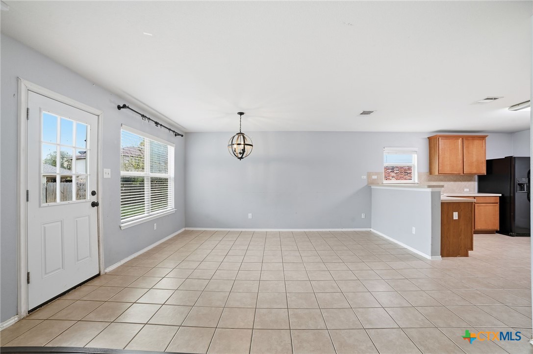 316 Housefinch Loop Leander, TX 78641 - Photo 4 of 37 Bright breakfast area with natural light and open flow to living spaces.