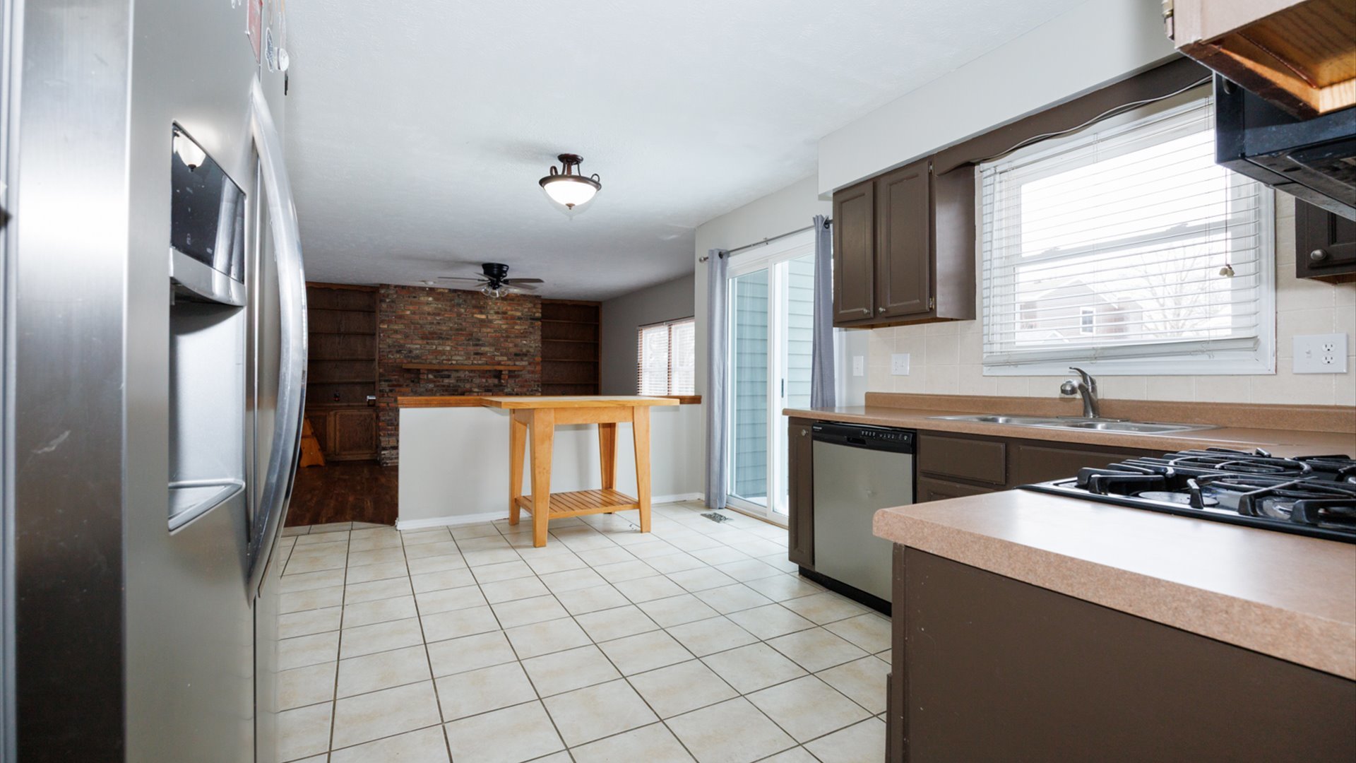 2007 Fallen Oak Road Bloomington, IL 61704 - Photo 11 of 44 a kitchen with a refrigerator and a sink