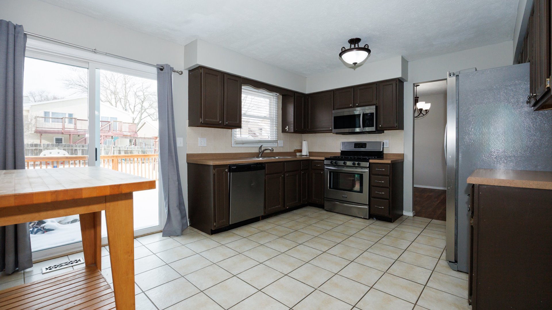 2007 Fallen Oak Road Bloomington, IL 61704 - Photo 13 of 44 a kitchen with stainless steel appliances granite countertop a stove a sink and a refrigerator