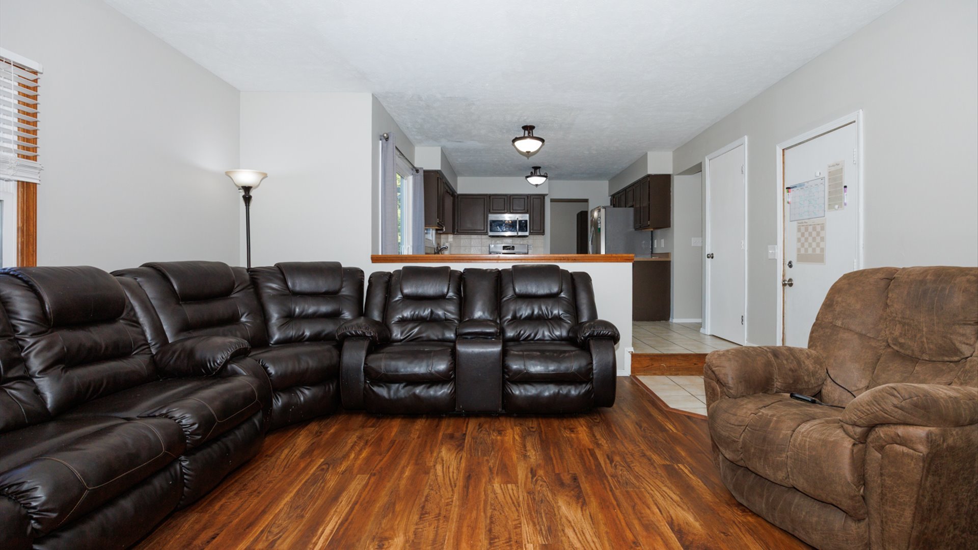 2007 Fallen Oak Road Bloomington, IL 61704 - Photo 14 of 50 a living room with furniture and wooden floor
