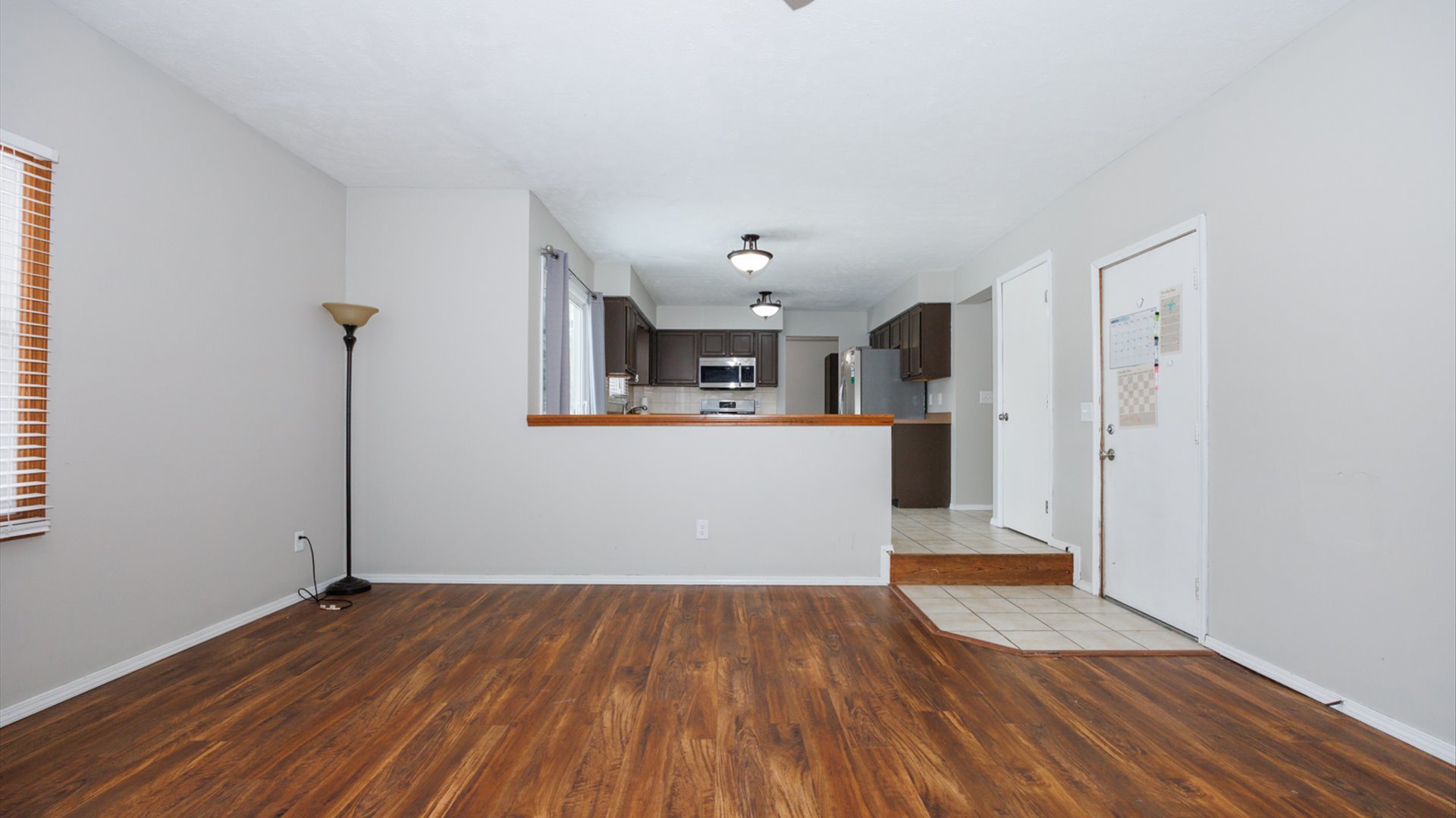 2007 Fallen Oak Road Bloomington, IL 61704 - Photo 16 of 44 a view of a kitchen with wooden floor and a sink
