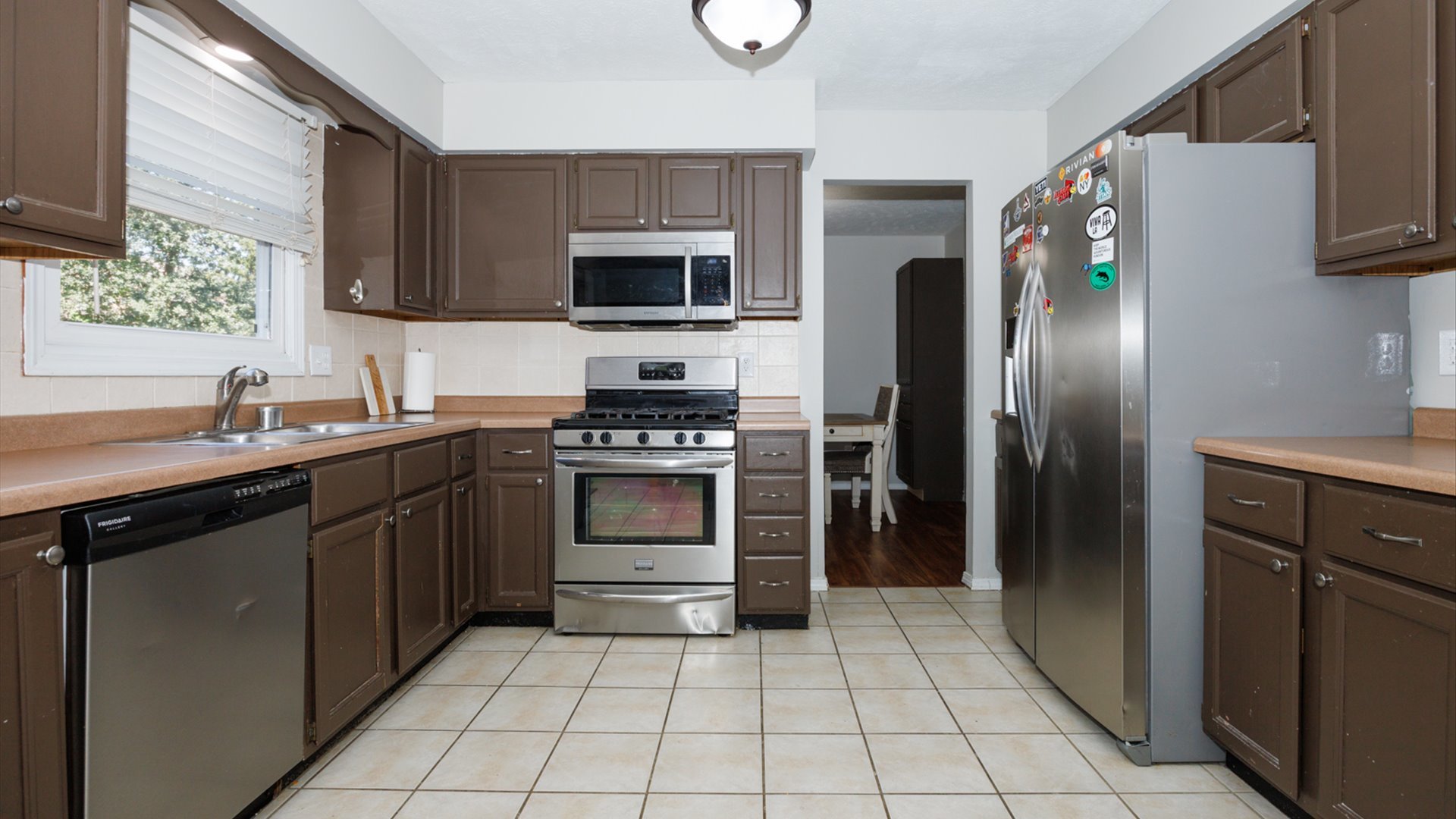 2007 Fallen Oak Road Bloomington, IL 61704 - Photo 18 of 50 a kitchen with stainless steel appliances a refrigerator sink and microwave
