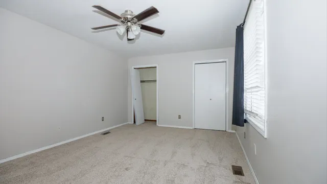 a utility room with cabinets and a wooden floors