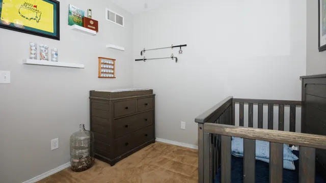 a view of a bedroom with baby crib