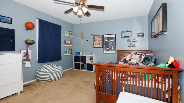 a bedroom with bed and a window