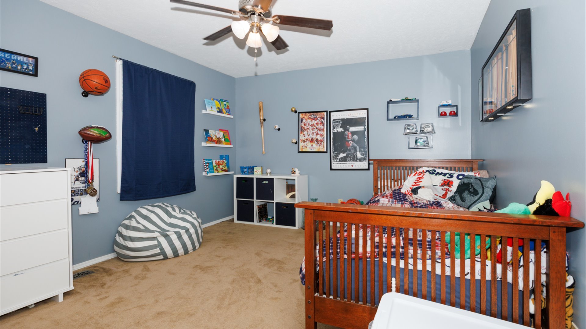 2007 Fallen Oak Road Bloomington, IL 61704 - Photo 28 of 50 a bedroom with furniture and a chandelier