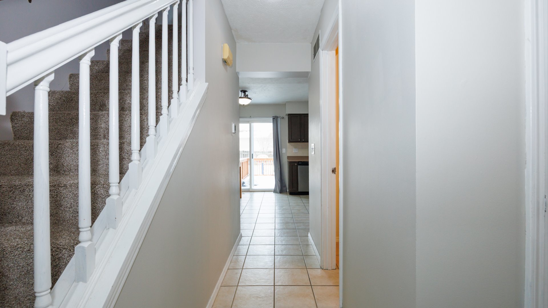 2007 Fallen Oak Road Bloomington, IL 61704 - Photo 3 of 44 a view of a hallway with wooden floor and staircase