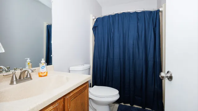 a bedroom with a bed and a flat tv screen