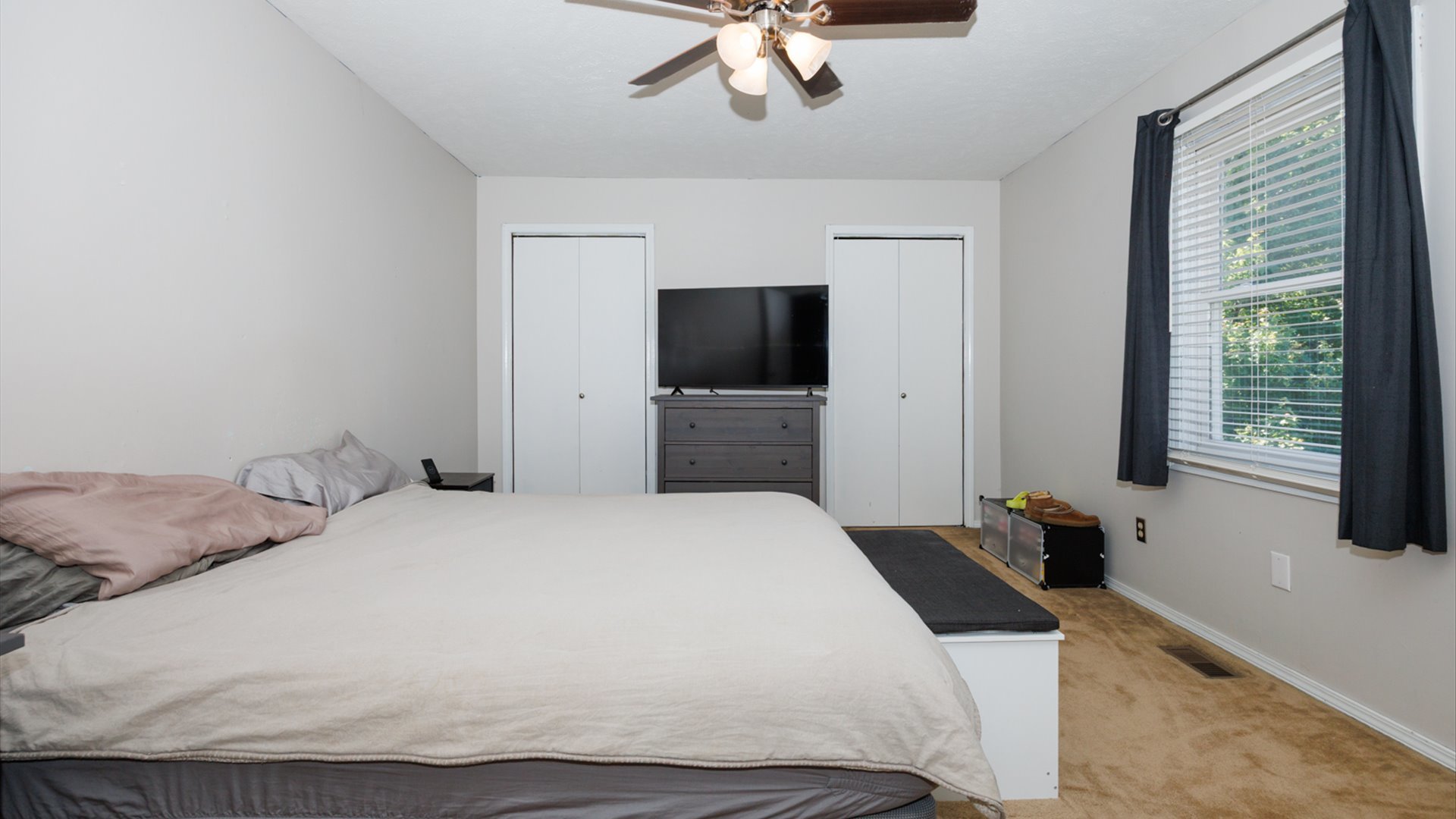 2007 Fallen Oak Road Bloomington, IL 61704 - Photo 33 of 50 a bedroom with a bed and a flat tv screen
