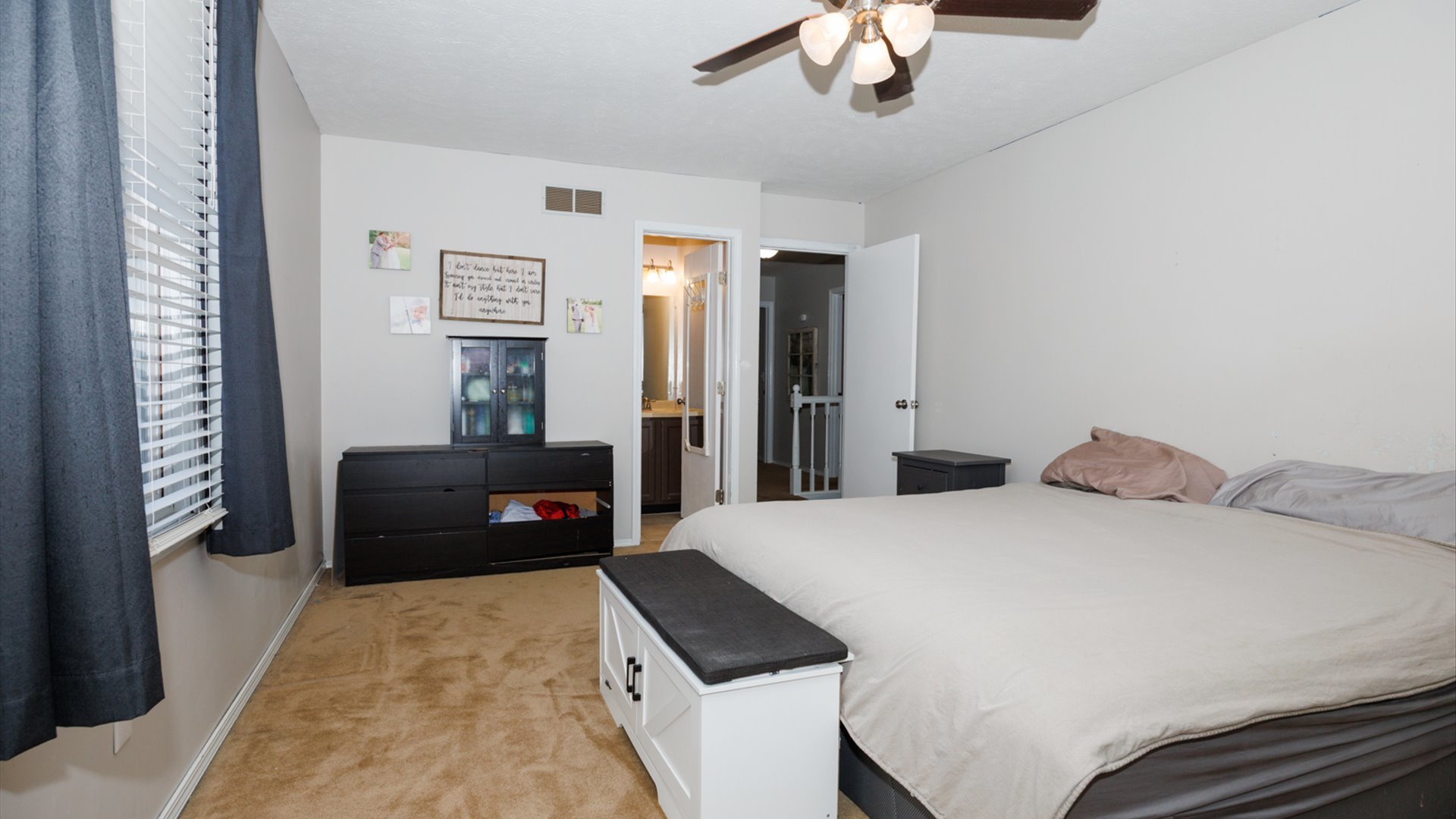 2007 Fallen Oak Road Bloomington, IL 61704 - Photo 34 of 50 a bedroom with a bed and a chandelier