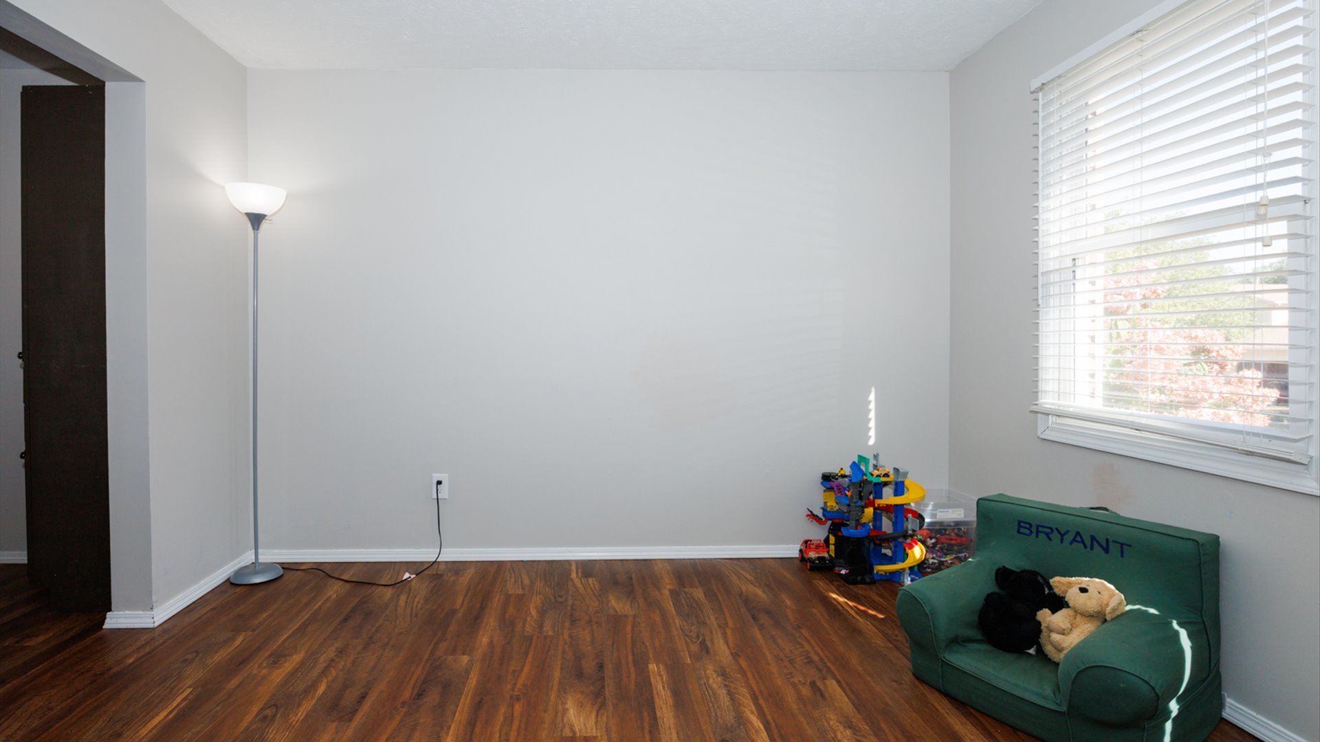 2007 Fallen Oak Road Bloomington, IL 61704 - Photo 4 of 50 a view of a room with wooden floor and lounge chairs