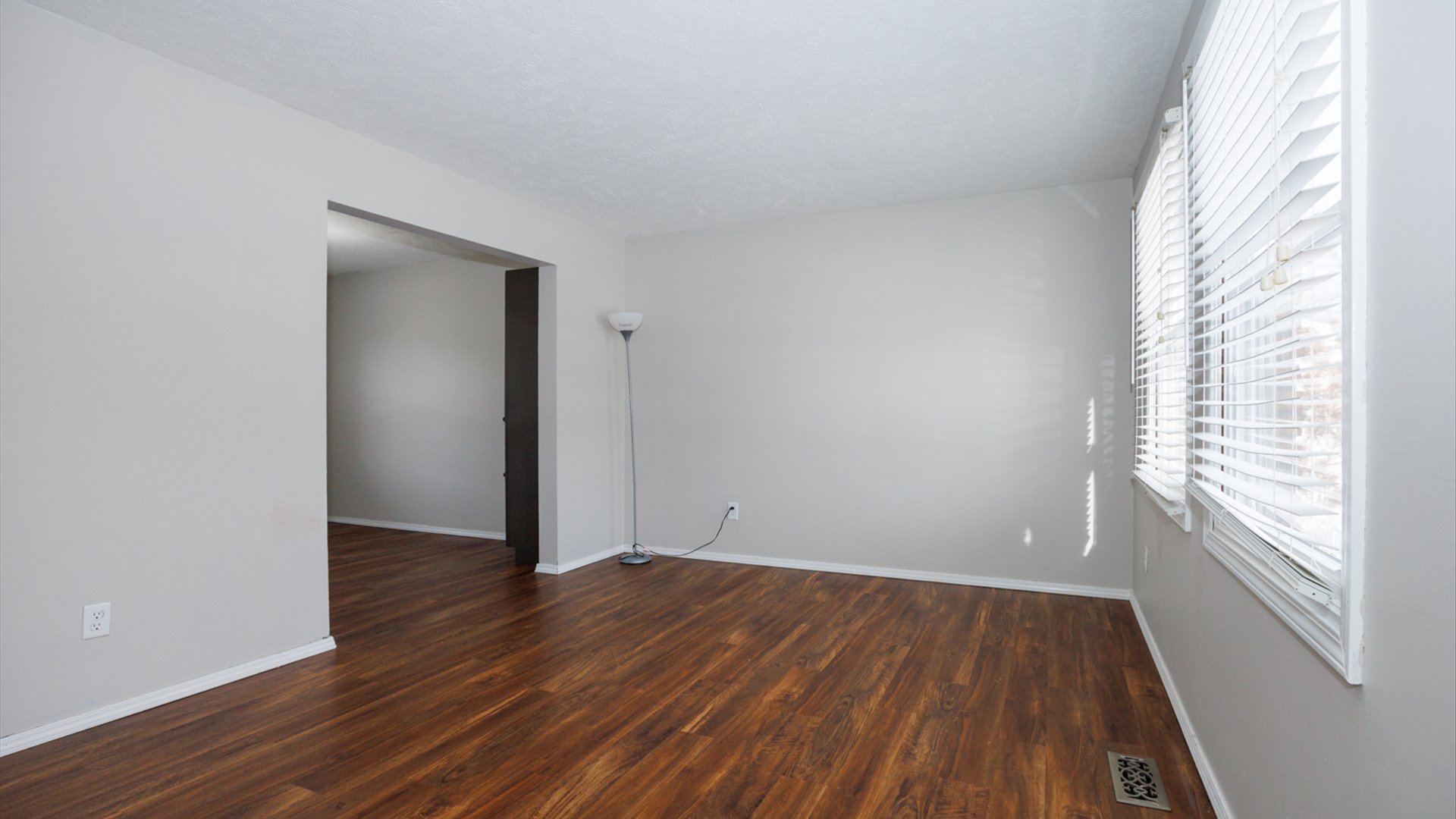2007 Fallen Oak Road Bloomington, IL 61704 - Photo 4 of 44 a view of an empty room with wooden floor and a window