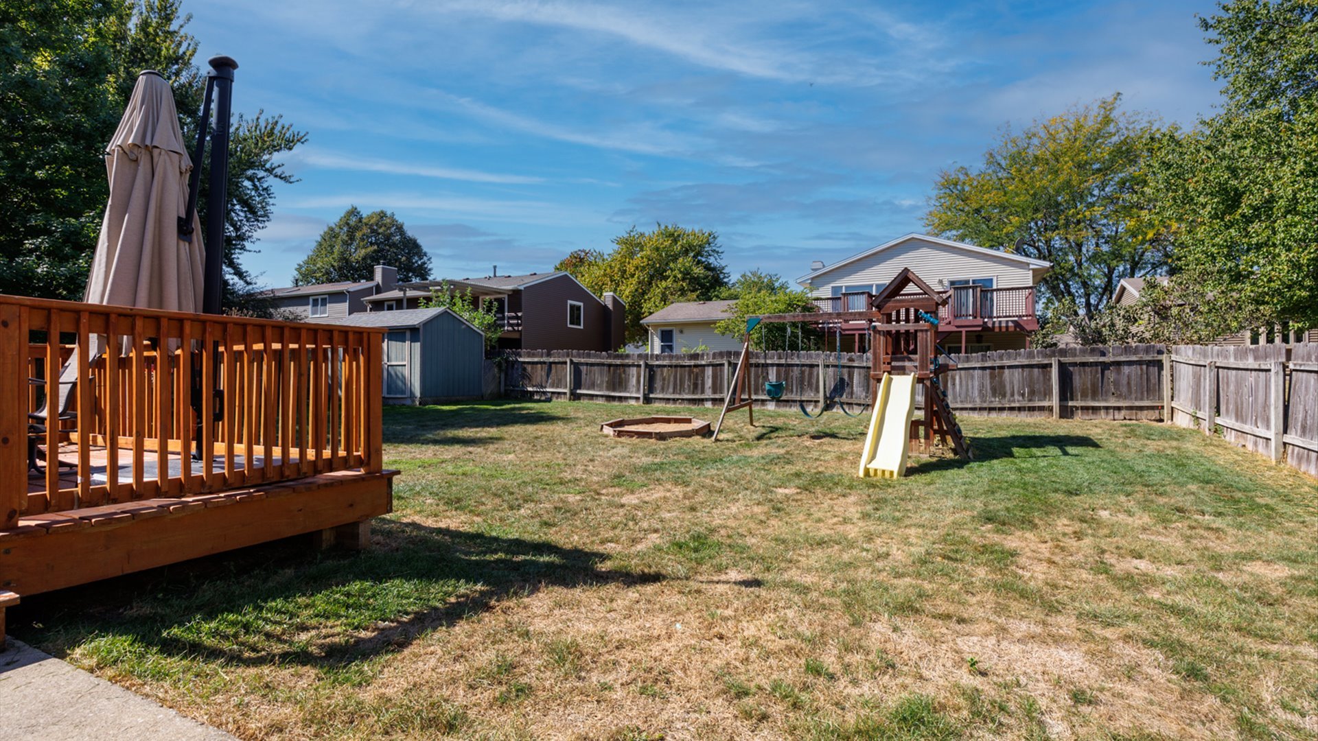 2007 Fallen Oak Road Bloomington, IL 61704 - Photo 43 of 50 a view of a house with backyard and wooden fence