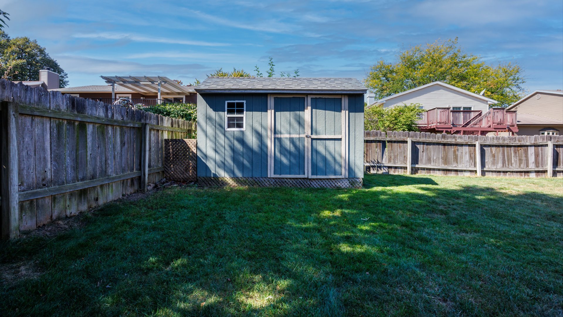 2007 Fallen Oak Road Bloomington, IL 61704 - Photo 47 of 50 a view of a house with a yard and sitting area