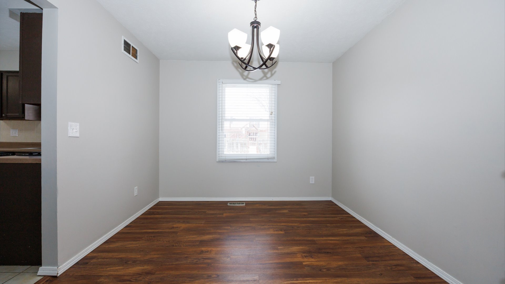 2007 Fallen Oak Road Bloomington, IL 61704 - Photo 8 of 44 a view of empty room with wooden floor and fan