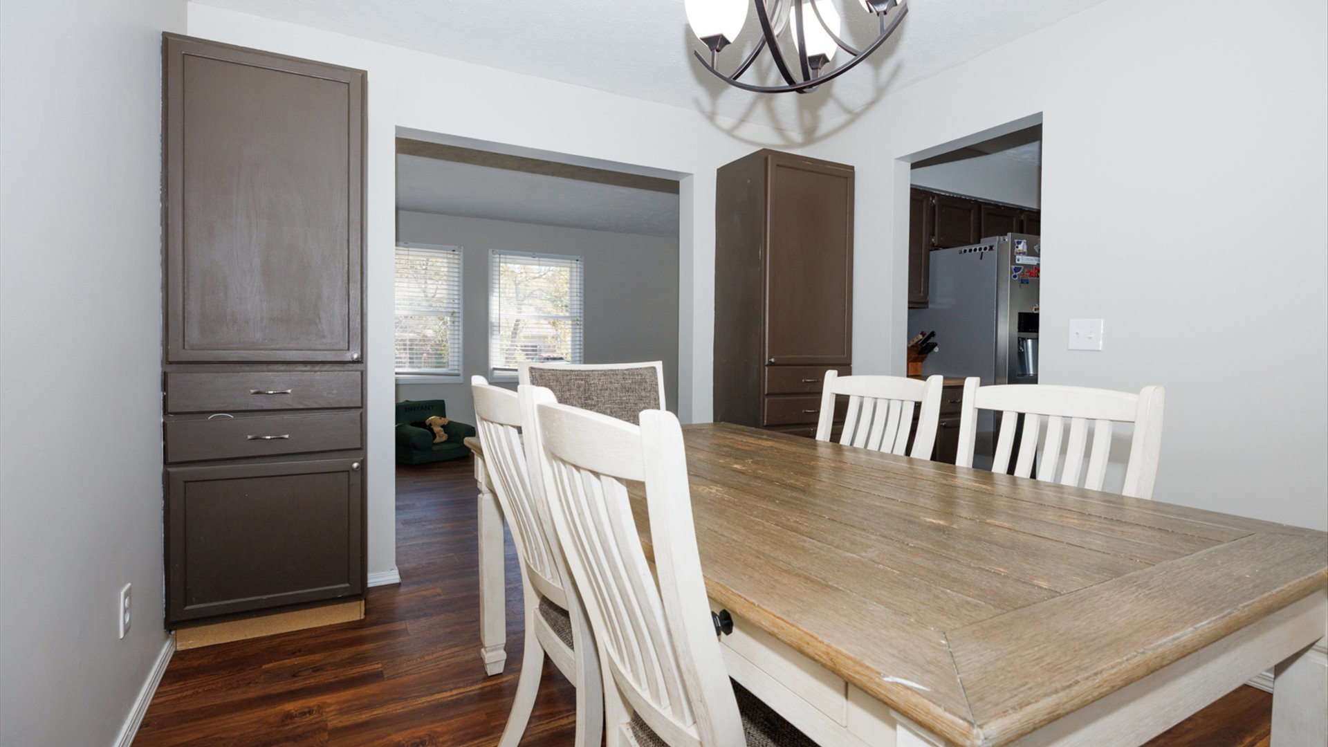 2007 Fallen Oak Road Bloomington, IL 61704 - Photo 10 of 50 a view of a dining room with furniture and wooden floor