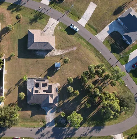 an aerial view of residential houses with outdoor space