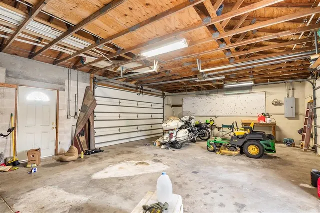 a view of a garage with parked cars