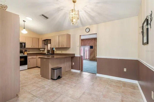 a kitchen with counter top space and appliances