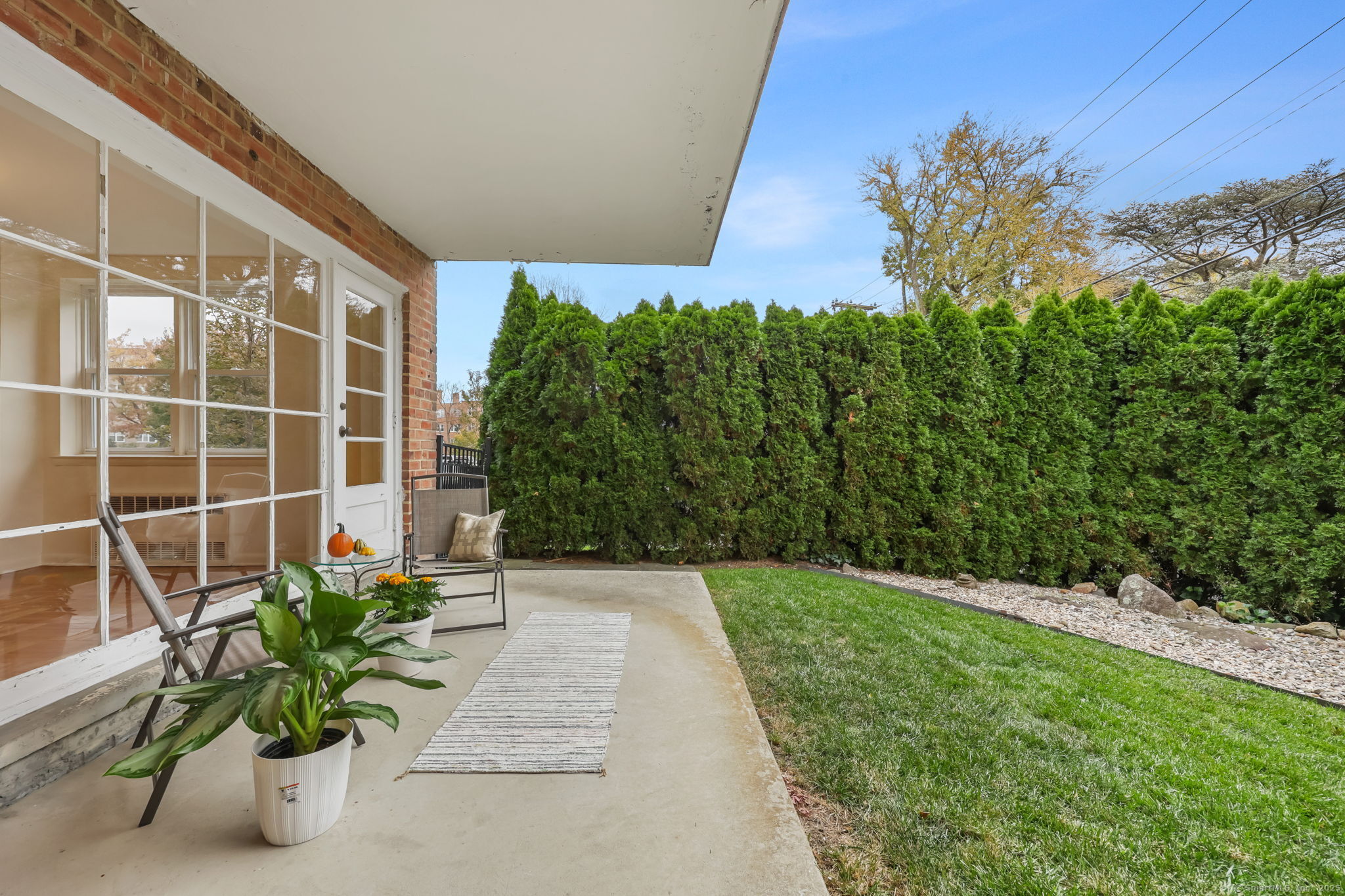 4 Putnam Hill, Unit 1C Greenwich, CT 06830 - Photo 1 of 29 a view of a garden with chair