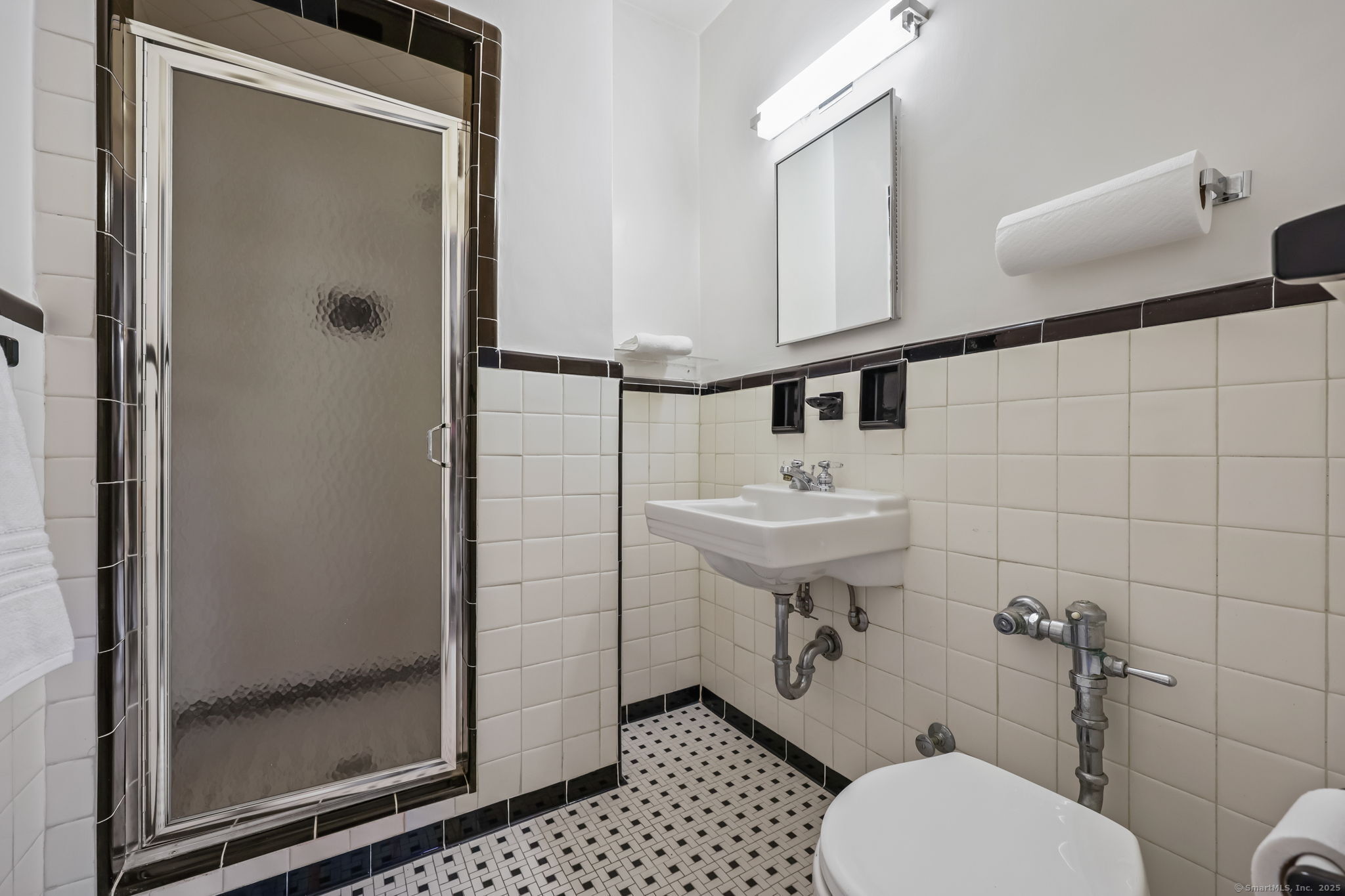 4 Putnam Hill, Unit 1C Greenwich, CT 06830 - Photo 16 of 29 a bathroom with a sink toilet and shower