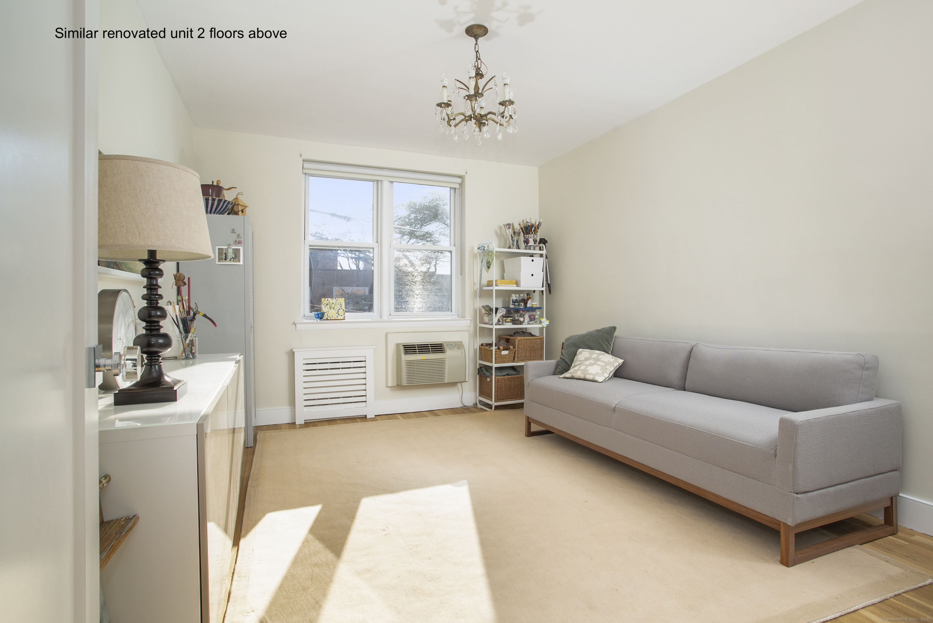 4 Putnam Hill, Unit 1C Greenwich, CT 06830 - Photo 17 of 29 a living room with furniture and a flat screen tv