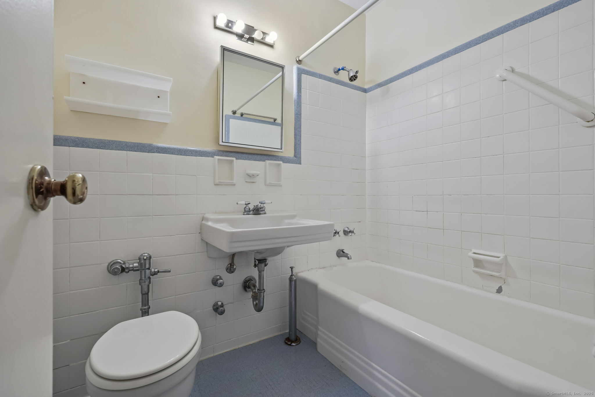 4 Putnam Hill, Unit 1C Greenwich, CT 06830 - Photo 20 of 29 a bathroom with a sink a toilet and bathtub