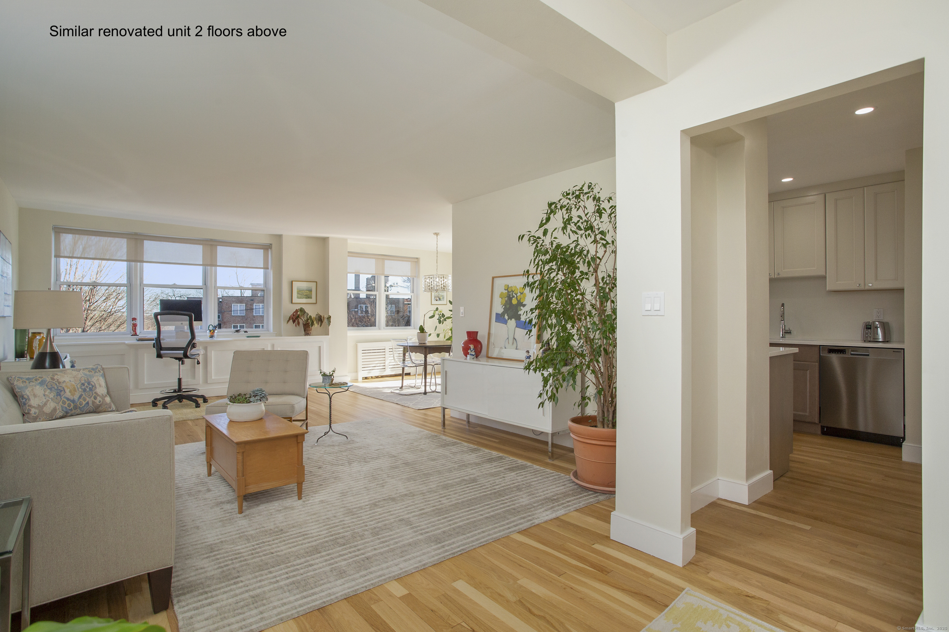 4 Putnam Hill, Unit 1C Greenwich, CT 06830 - Photo 2 of 29 a living room with furniture and a large window