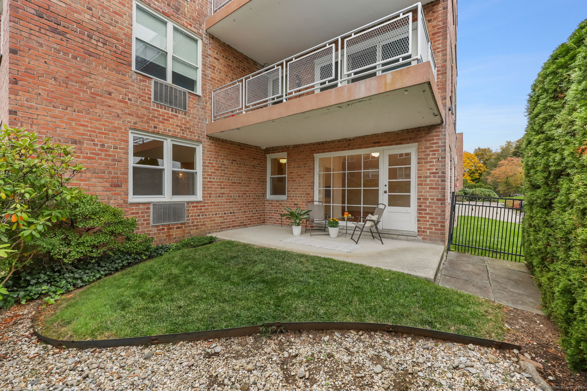 4 Putnam Hill, Unit 1C Greenwich, CT 06830 - Photo 21 of 29 a view of a house with backyard porch and sitting area