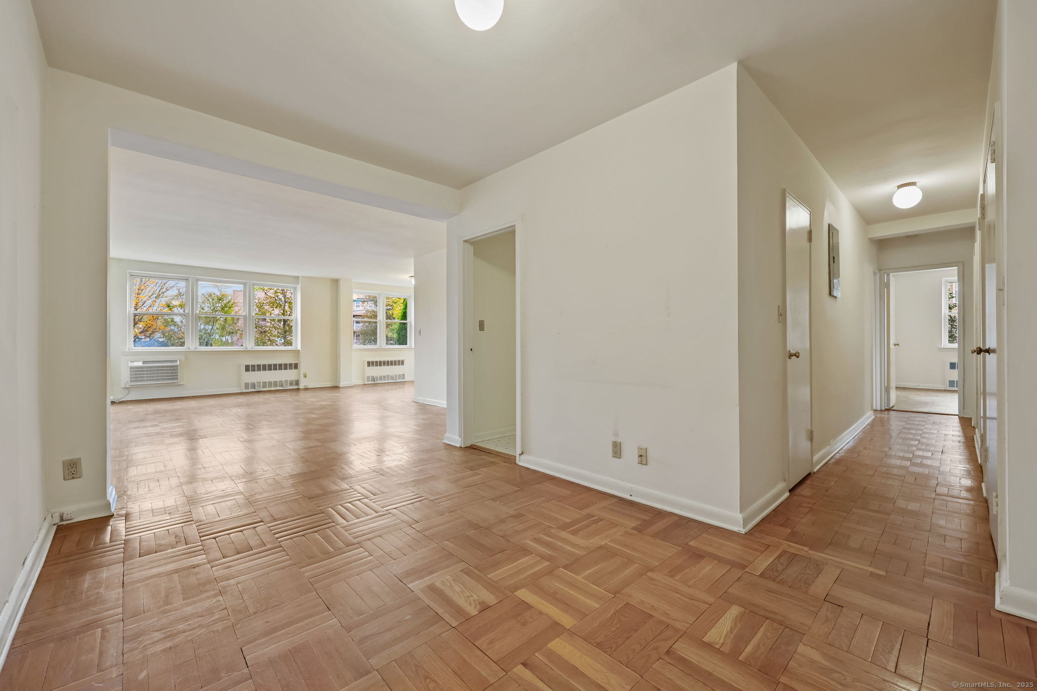 4 Putnam Hill, Unit 1C Greenwich, CT 06830 - Photo 4 of 29 an empty room with windows and entrance