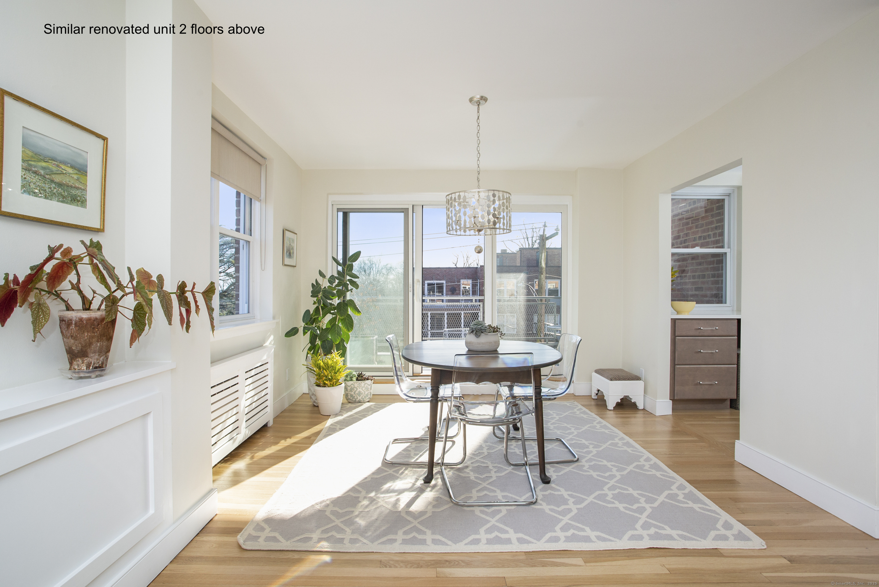 4 Putnam Hill, Unit 1C Greenwich, CT 06830 - Photo 7 of 29 a view of a dining room with furniture window and wooden floor